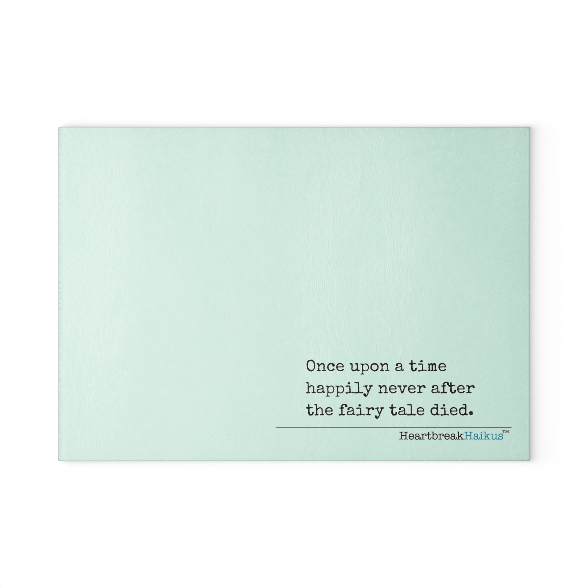 This cutting board features an original Heartbreak Haiku, perfect for adding a touch of creativity to your kitchen. The durable tempered glass material makes it a versatile preparation surface, while the vibrant colors and unique decoration process ensure